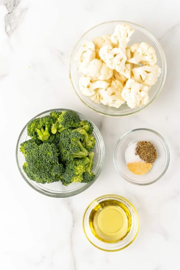 Ingredients needed to prepare broccoli and cauliflower in the air fryer.