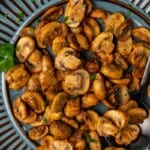 Air Fryer Mushrooms served on a blue plate.