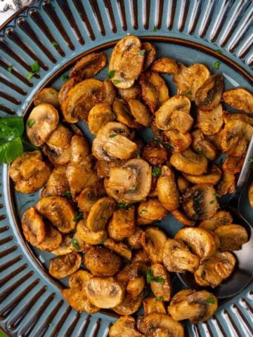 Air Fryer Mushrooms served on a blue plate.