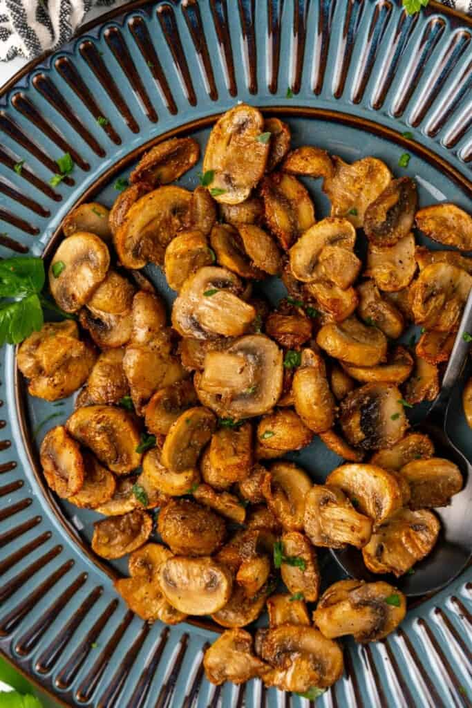 Air Fryer Mushrooms served on a blue plate.