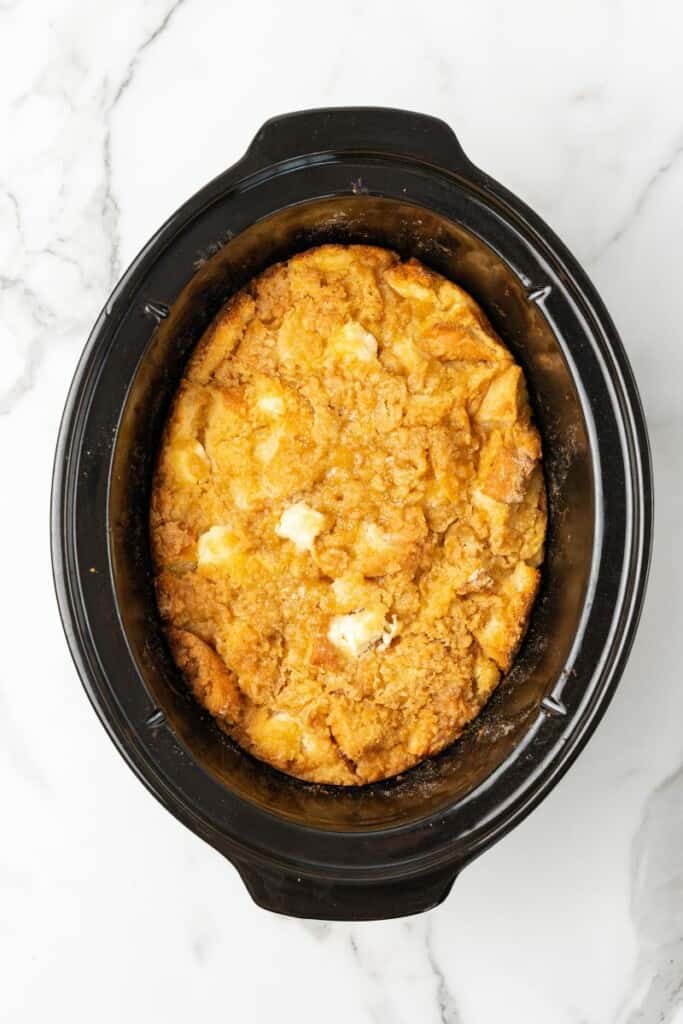 Overhead view of crockpot french toast casserole after it has slowly cooked.