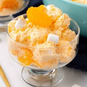 Clear glass bowl with Orange Dreamsicle Salad inside.