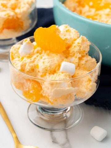 Clear glass bowl with Orange Dreamsicle Salad inside.