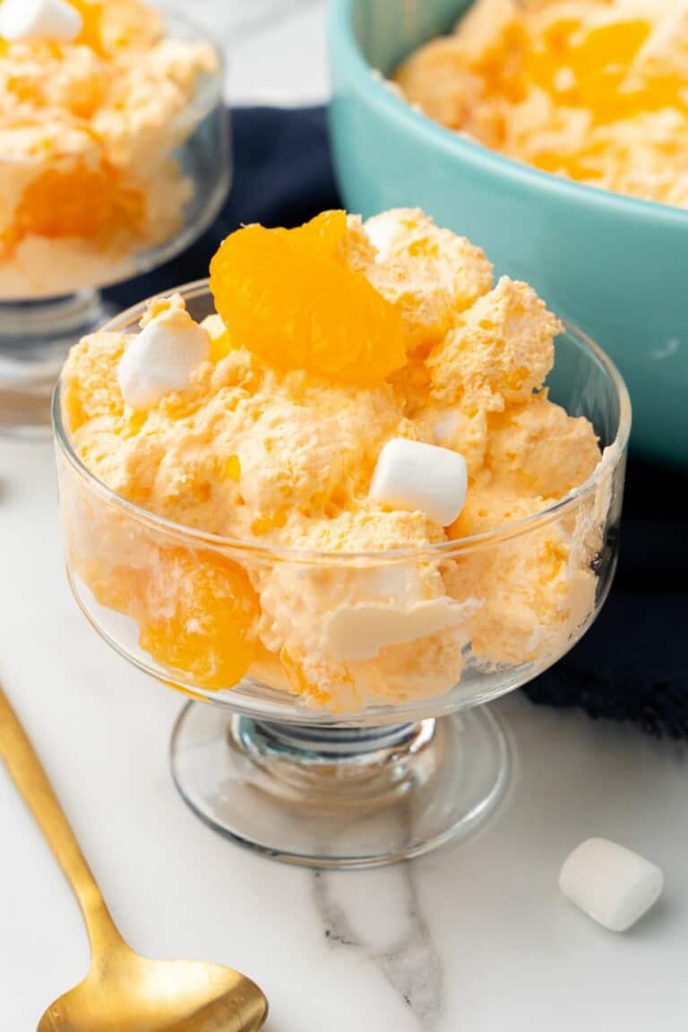 Clear glass bowl with Orange Dreamsicle Salad inside.