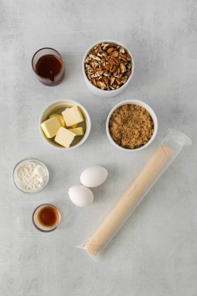 Ingredients needed to prepare pecan pie without corn syrup.
