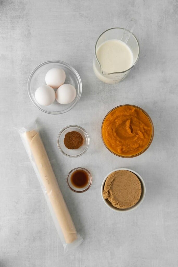 Overhead view of ingredients needed to prepare pumpkin pie without evaporated milk.