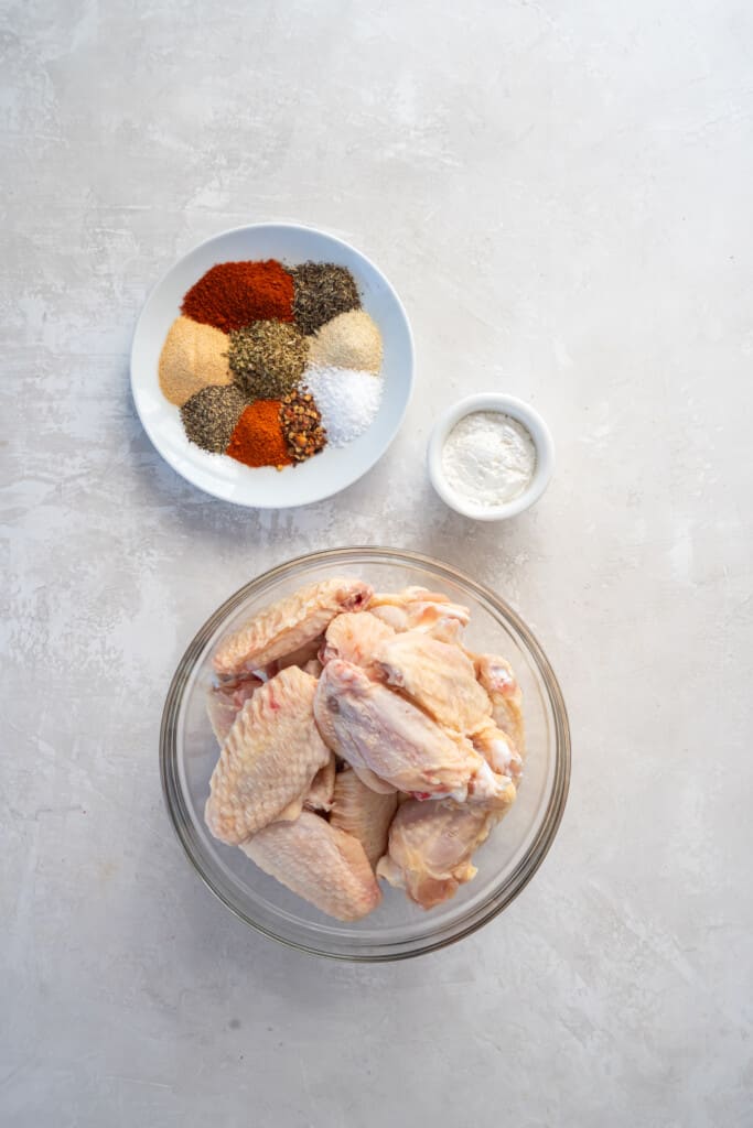 Overhead view of ingredients to make air fryer chicken wings with dry rub.