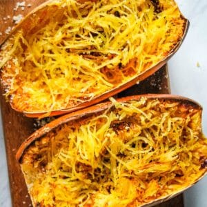 Overhead view of air fryer spaghetti squash with strands mixed in.