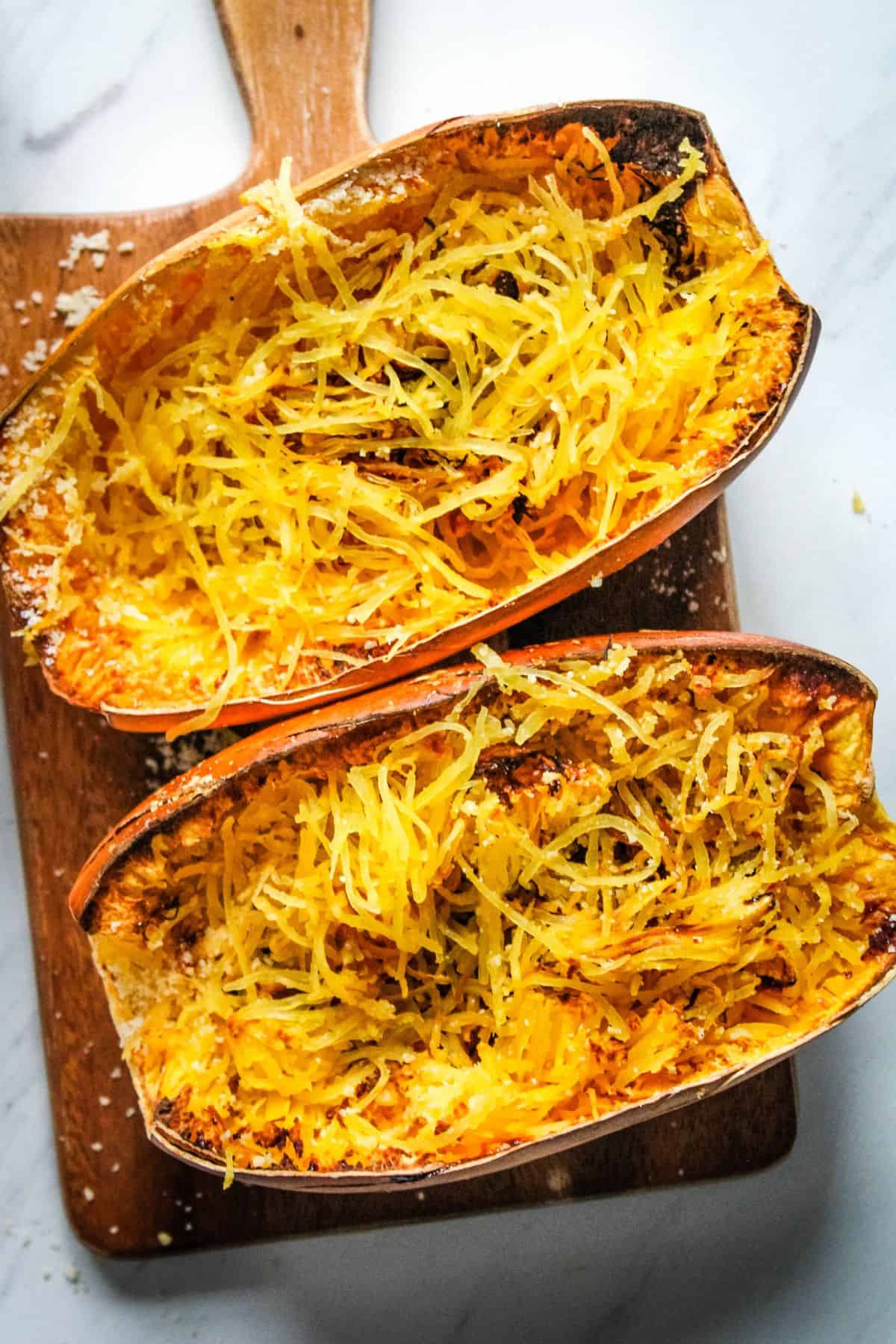 Overhead view of air fryer spaghetti squash with strands mixed in.