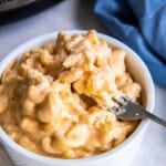 White bowl of 3 ingredient macaroni and cheese prepared in a slow cooker.