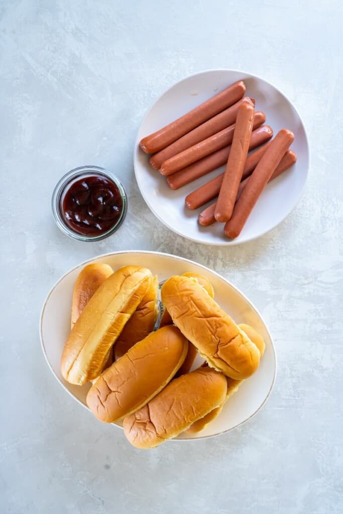 Ingredients needed to prepare bbq hot dogs.