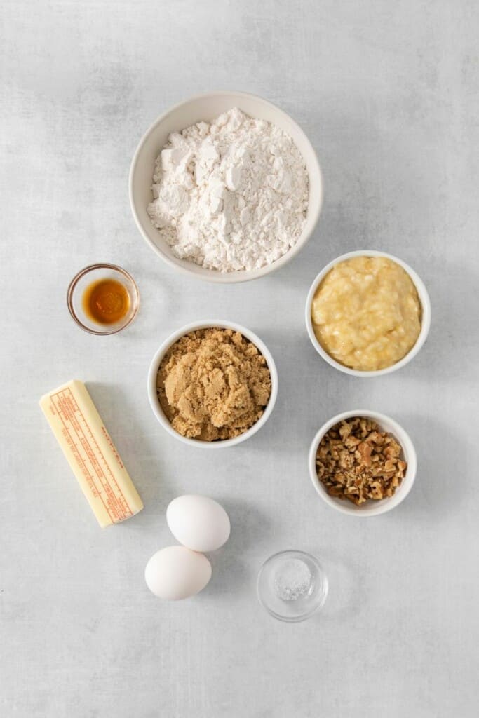 Ingredients needed to prepare a loaf of banana bread.