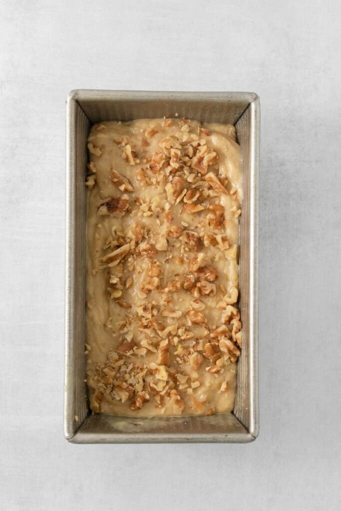 Banana Bread batter poured into a baking pan ready to go into the oven.