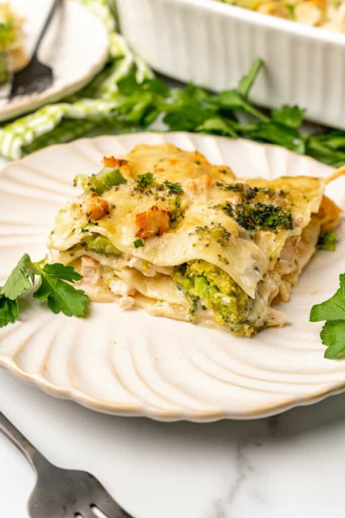 Chicken and Broccoli Lasagna on an off white plate.
