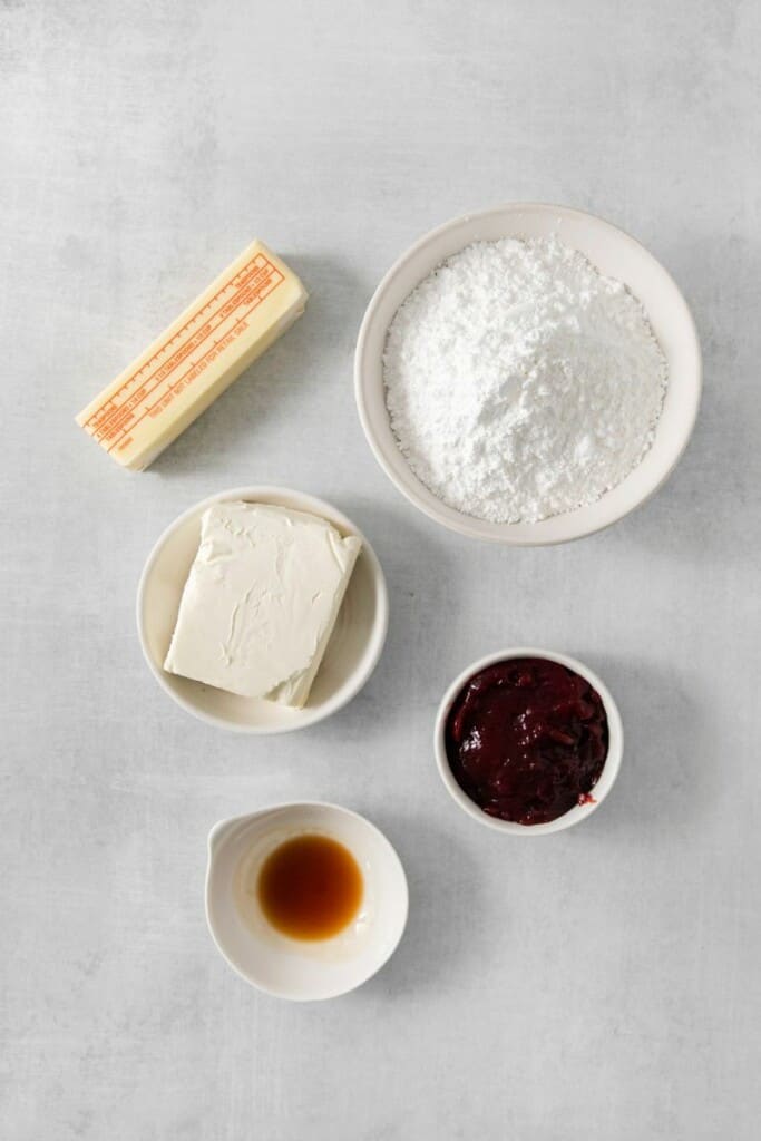 Ingredients required to prepare raspberry cream cheese frosting.