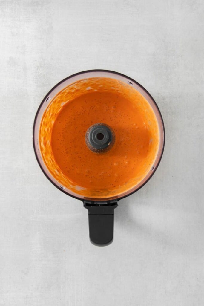 The combined ingredients of smoky red pepper crema in a food processor.