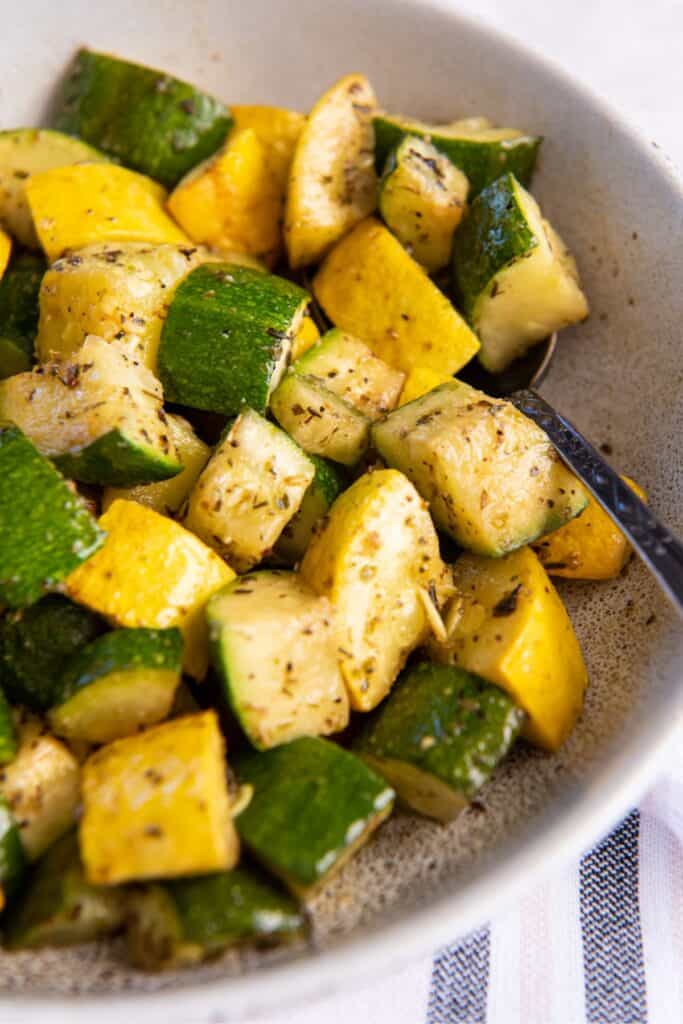 Close up of air fryer zucchini and squash in a bowl.