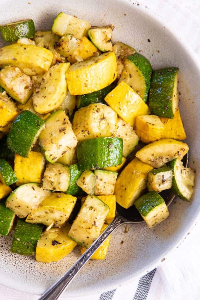 Air fry zucchini and squash in a bowl.