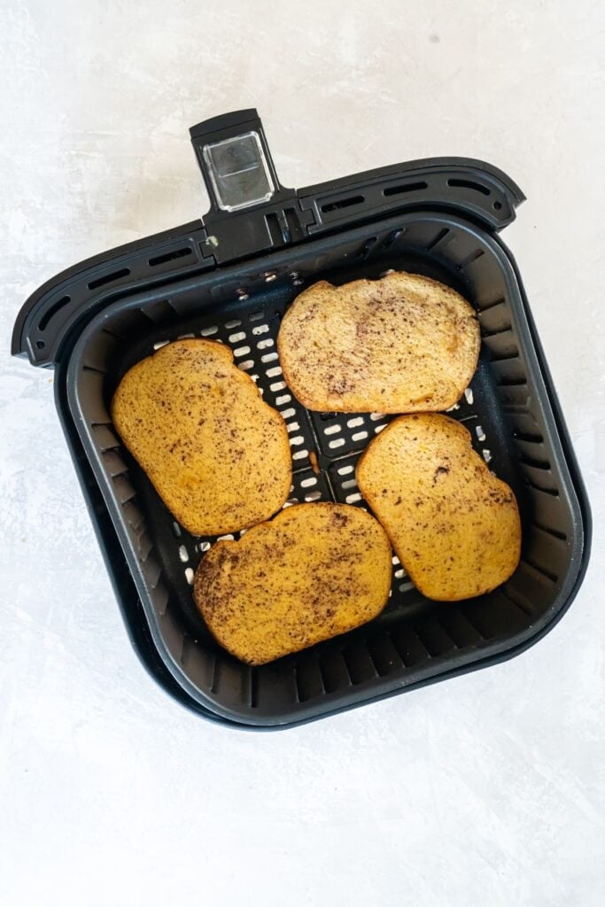 French toast in an air fryer basket.