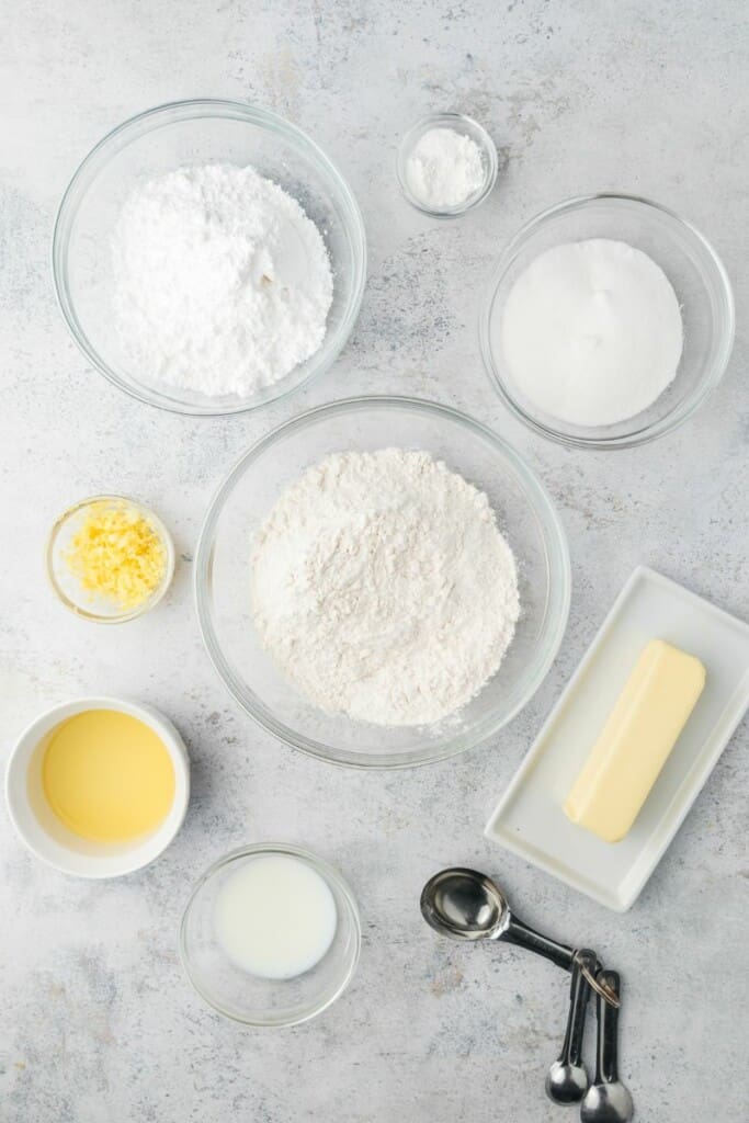 Ingredients needed to prepare lemon shortbread cookies.