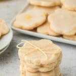 A stack of lemon shortbread cookies with a bow on top of the stack.