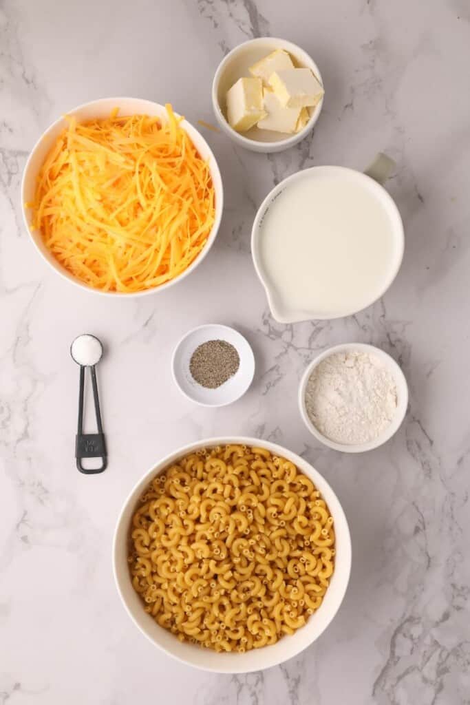 Ingredients needed to prepare macaroni and cheese.