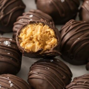 Closeup of peanut butter balls with rice krispies with a bite taken out