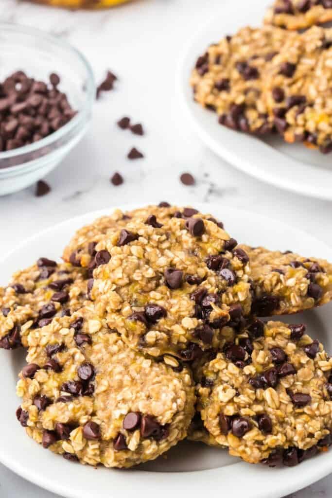 Several oatmeal chocolate chip banana cookies on a dessert plate.