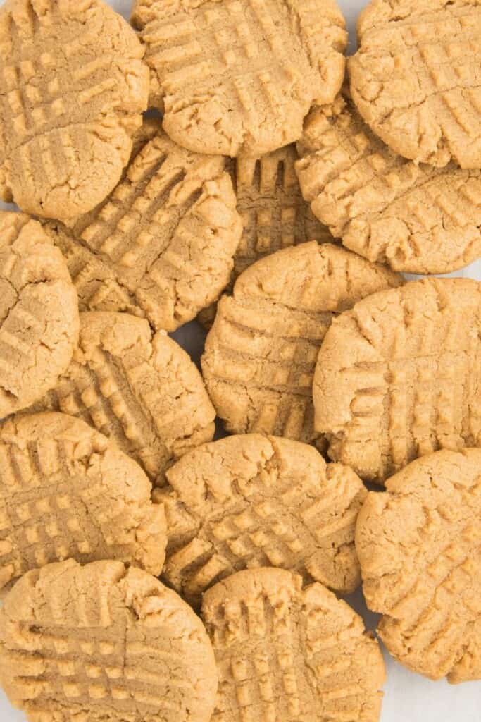 A pile of baked peanut butter cookies.