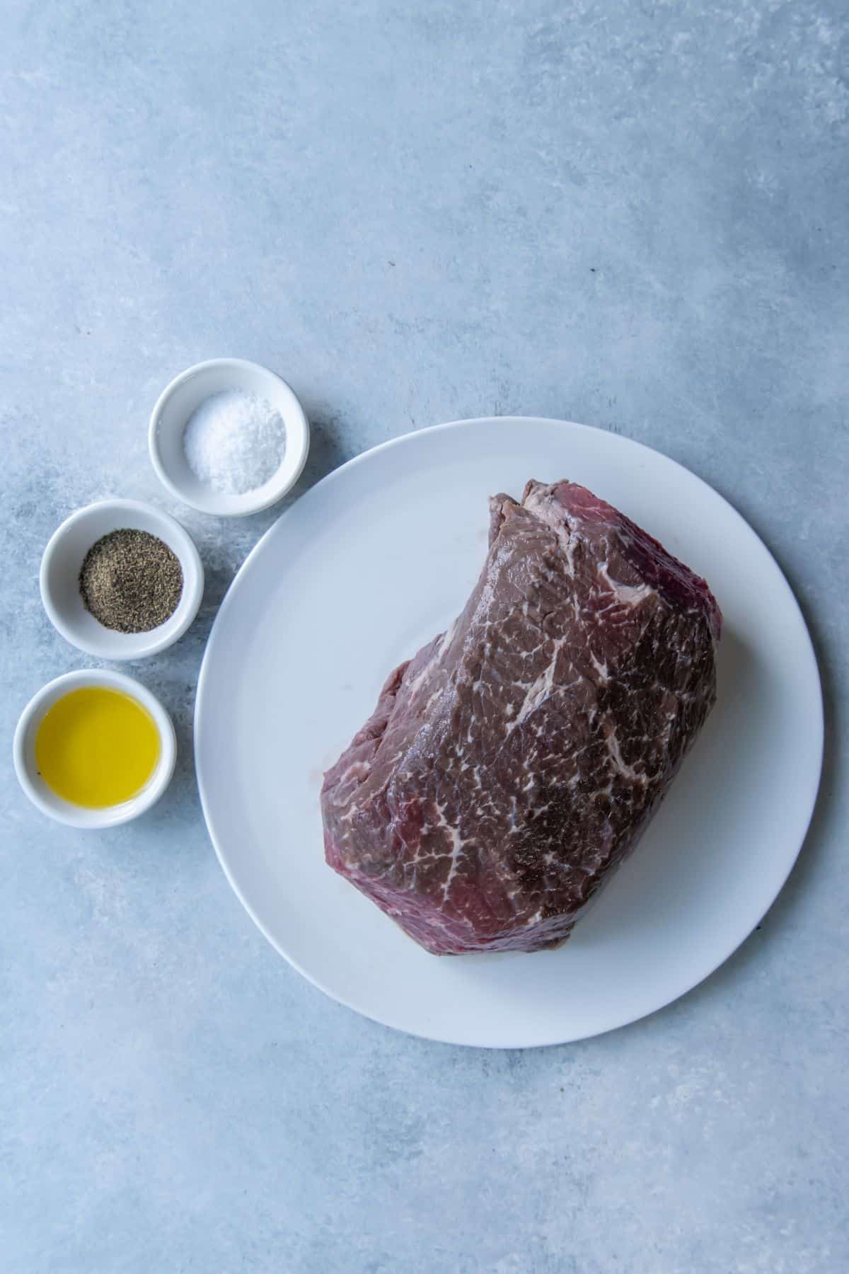 Ingredients needed to make an air fryer roast: roast beef, oil, salt, and pepper.