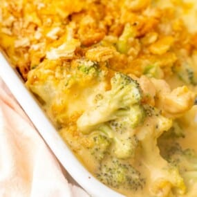Close up view of prepared ritz broccoli casserole in a casserole dish.