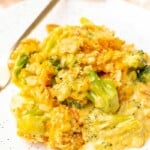 A serving of broccoli casserole on a white plate.