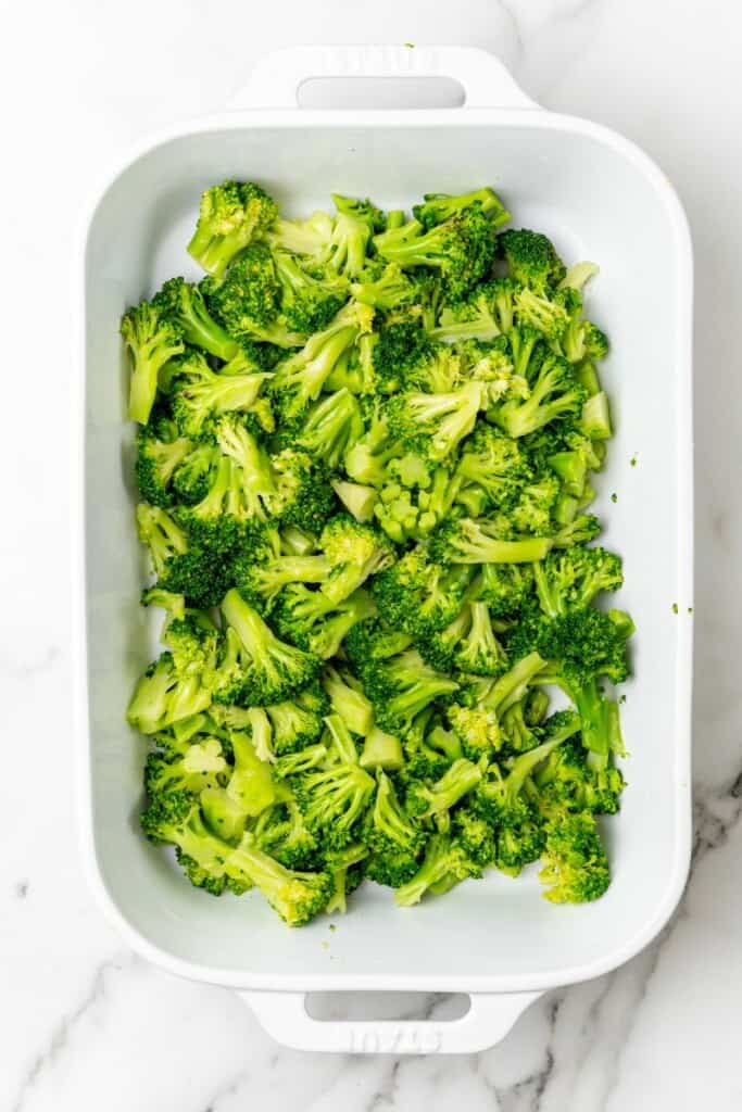 Blanched broccoli in a casserole dish.