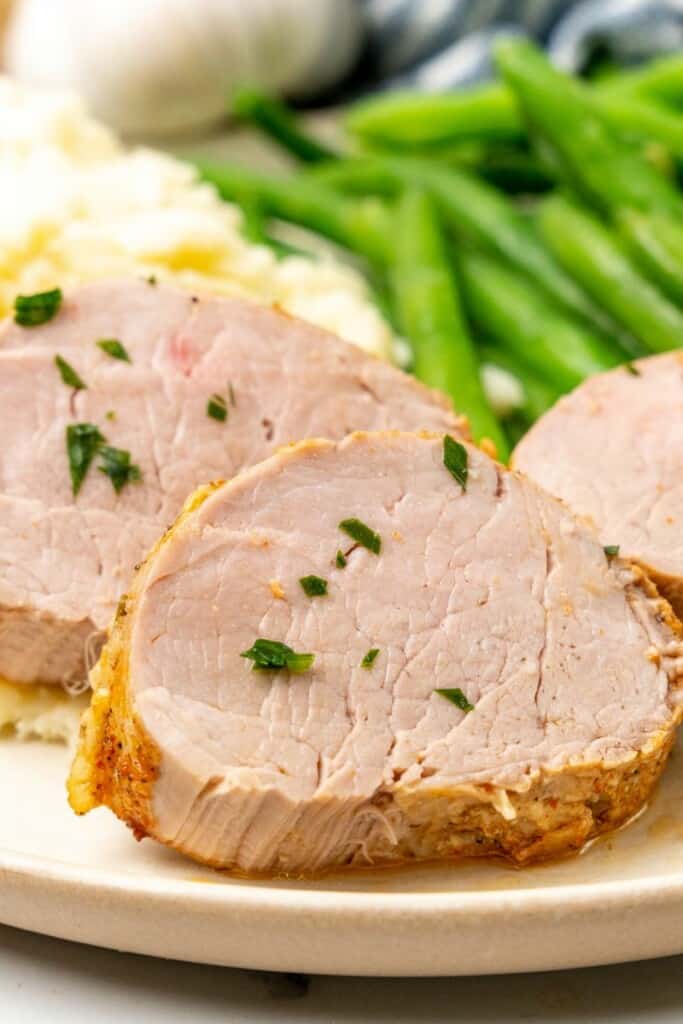 Close up view of a slice of pork tenderloin.