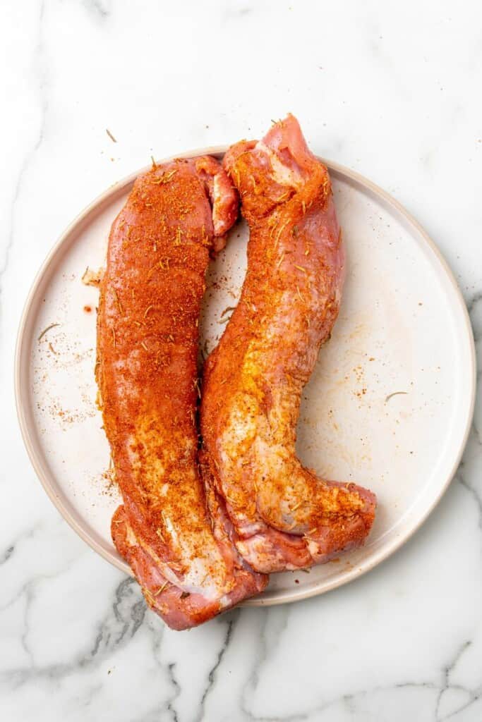 Seasoned pork loin ready to be cooked.