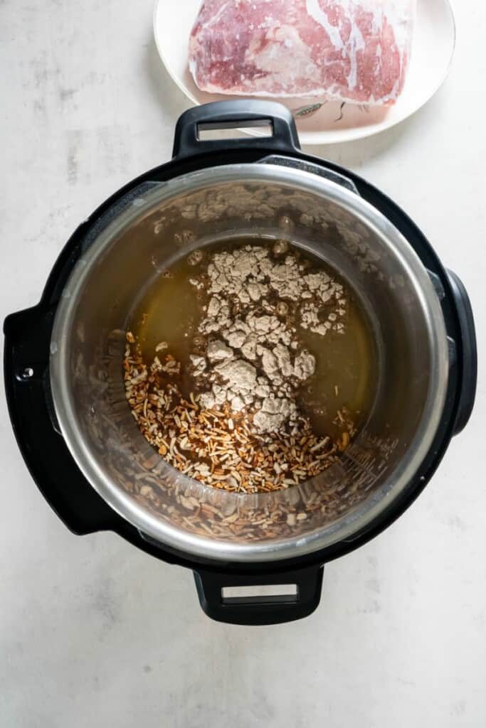 Combining broth and dry soup mixes in the instant pot.