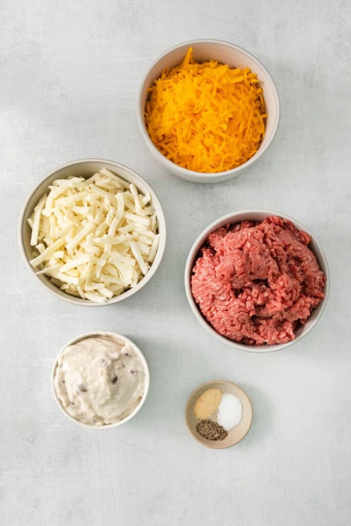 Ingredients needed to prepare hamburger hash brown casserole.