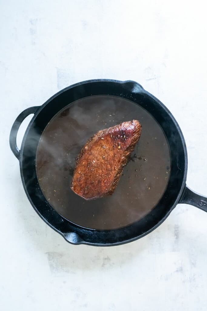 London Broil in a cast iron skillet.