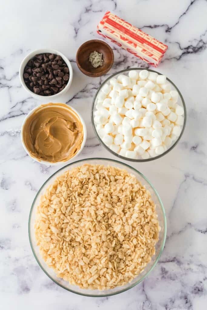 Ingredients needed to prepare peanut butter rice krispie treats.