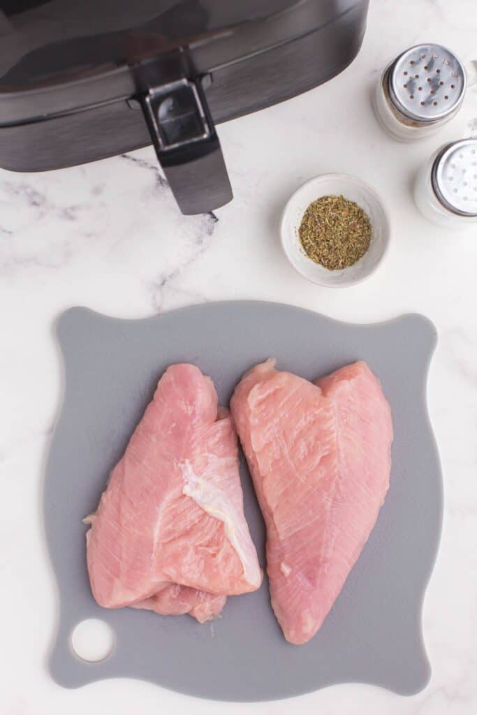 Ingredients to needed to cook air fryer turkey tenderloin: turkey tenderloins, Italian seasoning, salt, and pepper.
