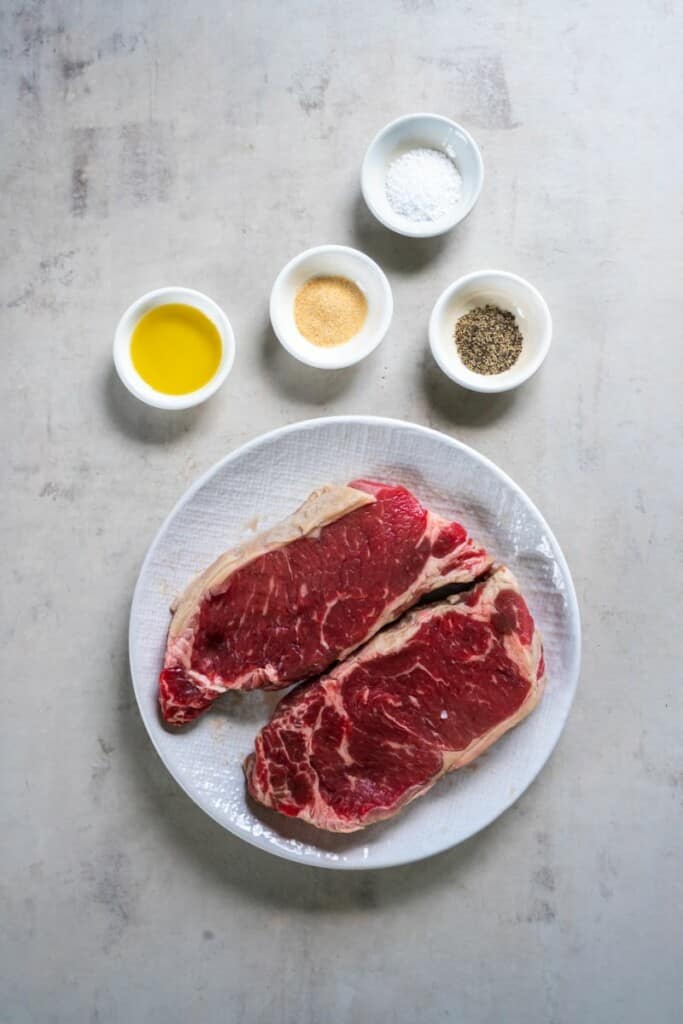 Ingredients needed to prepare new york strip steak in an air fryer.