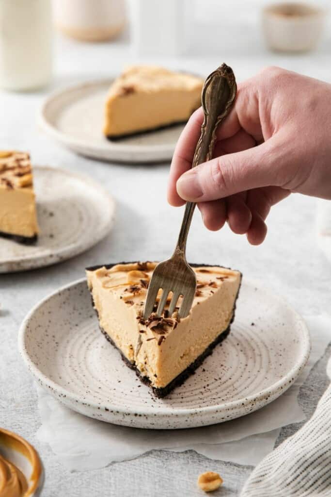 A fork getting a bite of peanut butter pie.