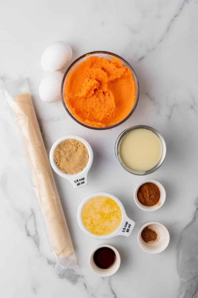 Ingredients needed to prepare a sweet potato pie.