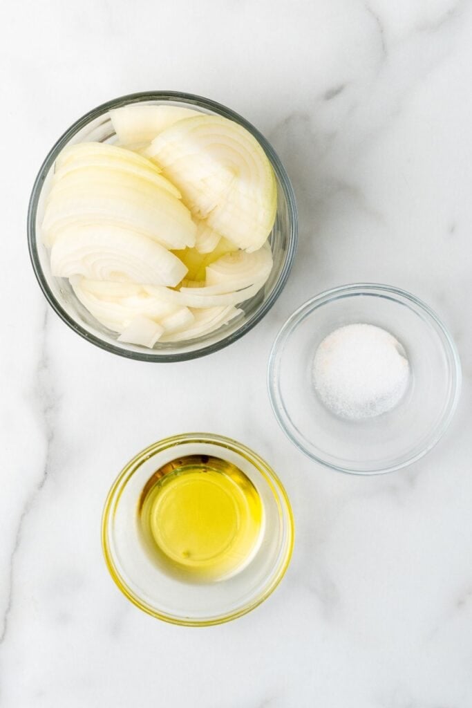 Ingredients needed to air fry onions: raw onions, oil, and salt.