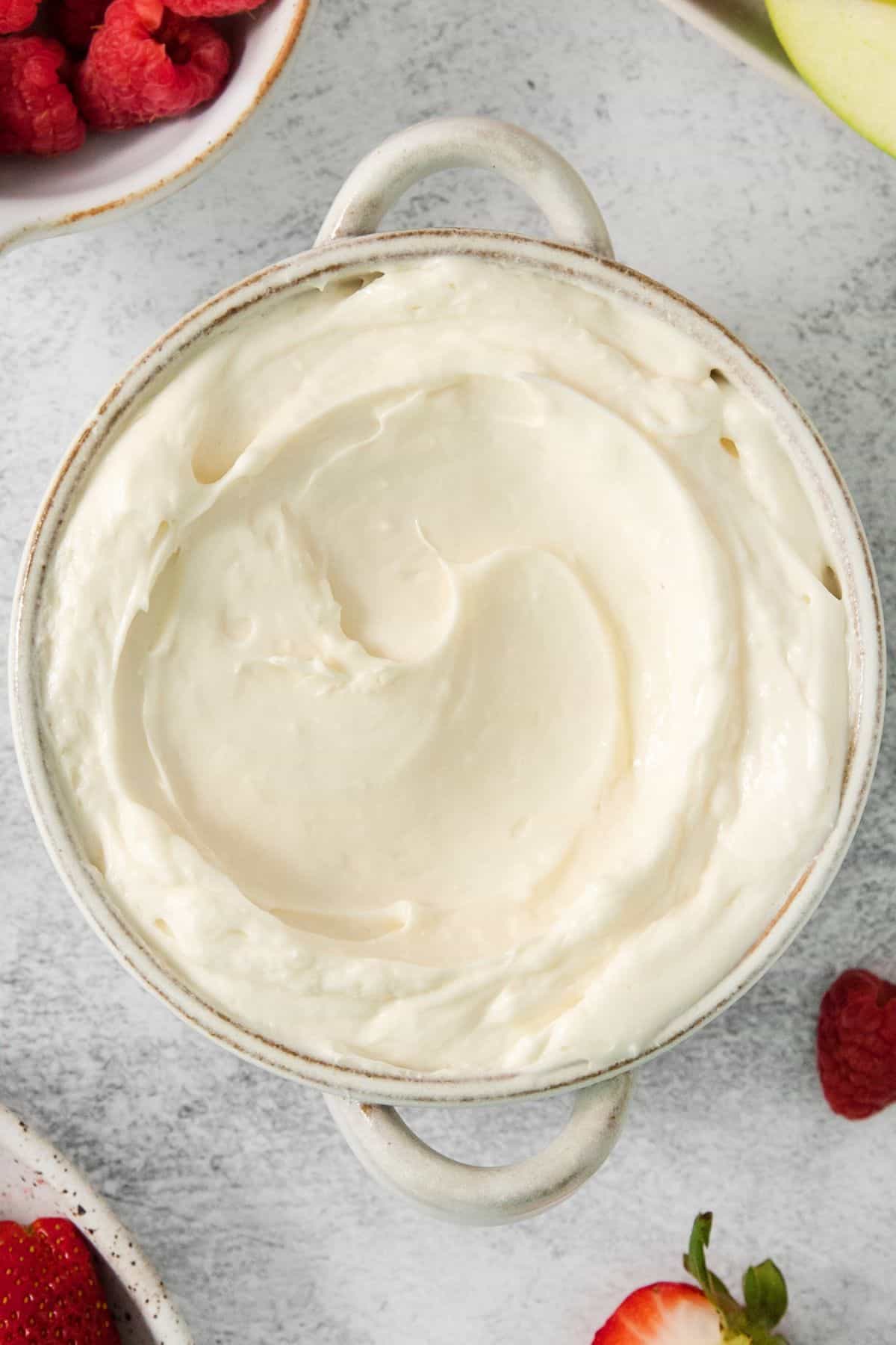The marshmallow fluff fruit dip transferred into a serving bowl.