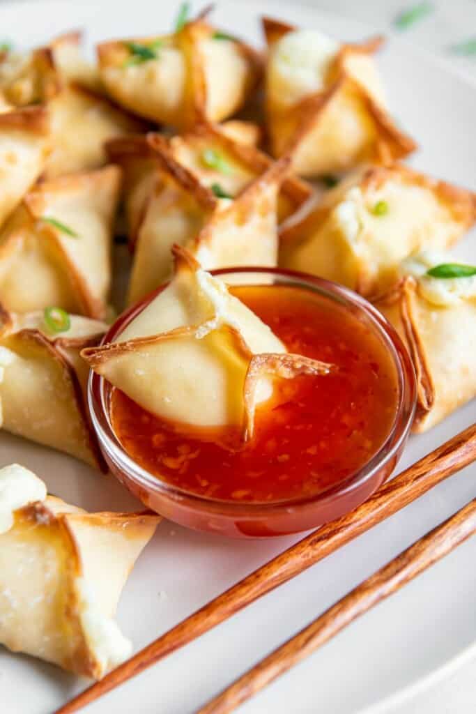 cream cheese wonton dipped into sweet chili sauce