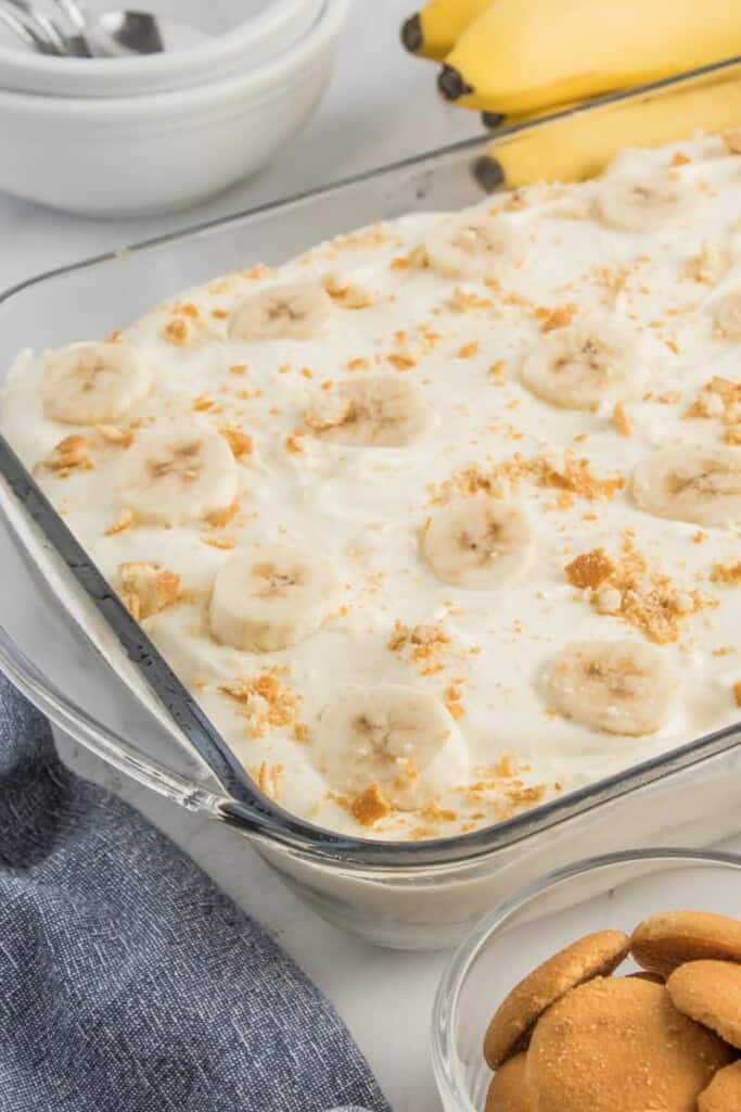 a casserole dish with banana pudding made with sweetened condensed milk