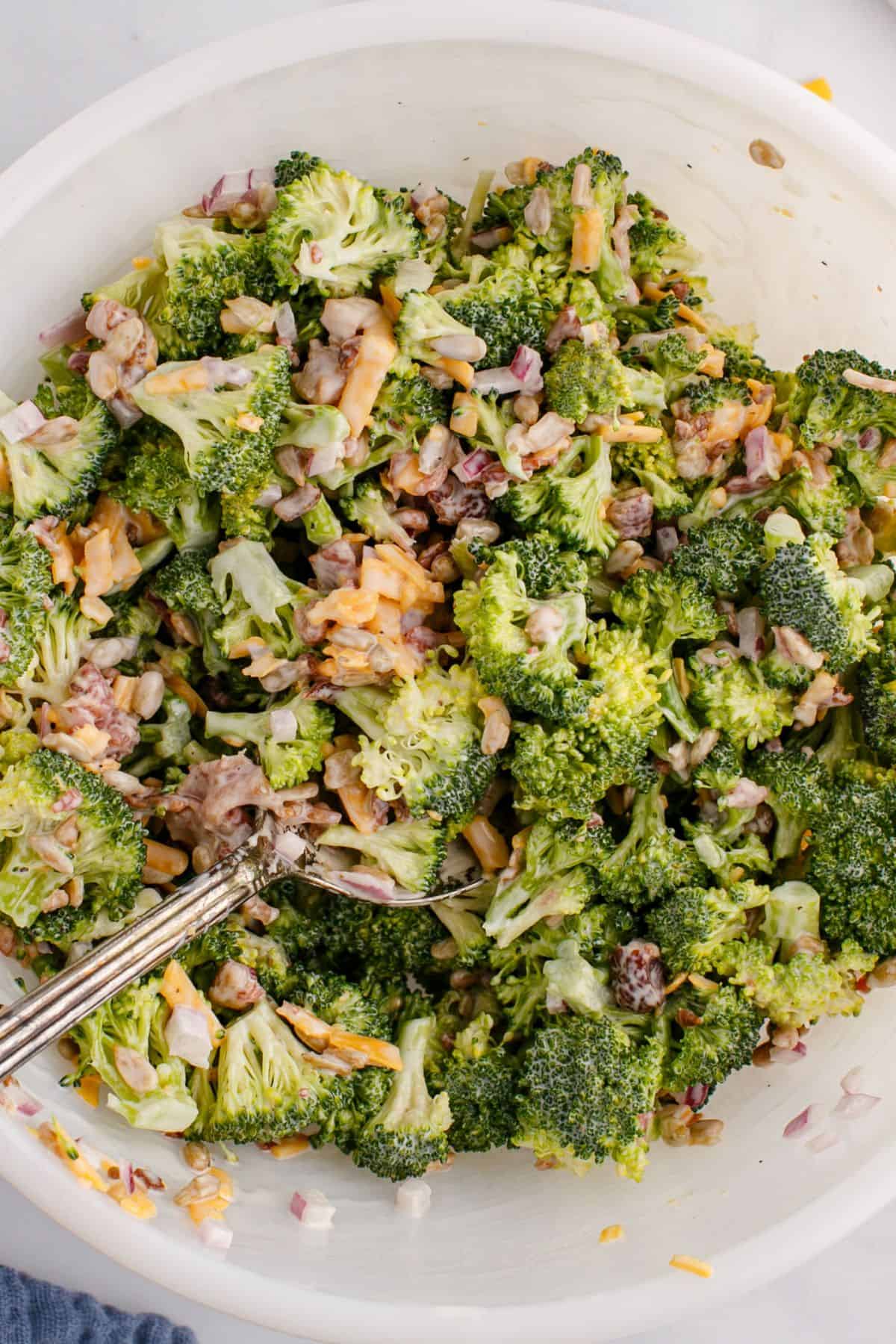 Broccoli crunch salad mixed in a bowl.