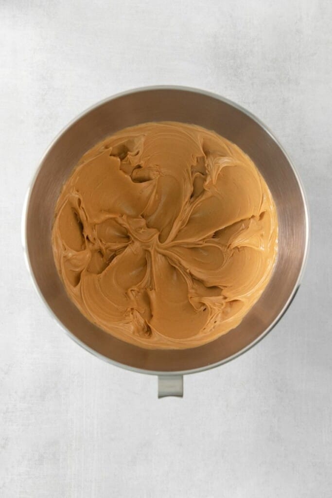 blending peanut butter with butter and vanilla 