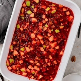 Overhead view of cranberry jello salad in a 9x13 baking dish.